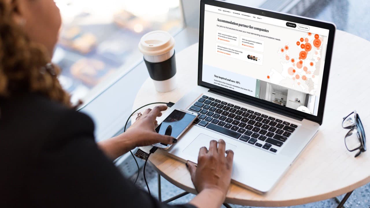 Person browsing the accommodation service front page on laptop